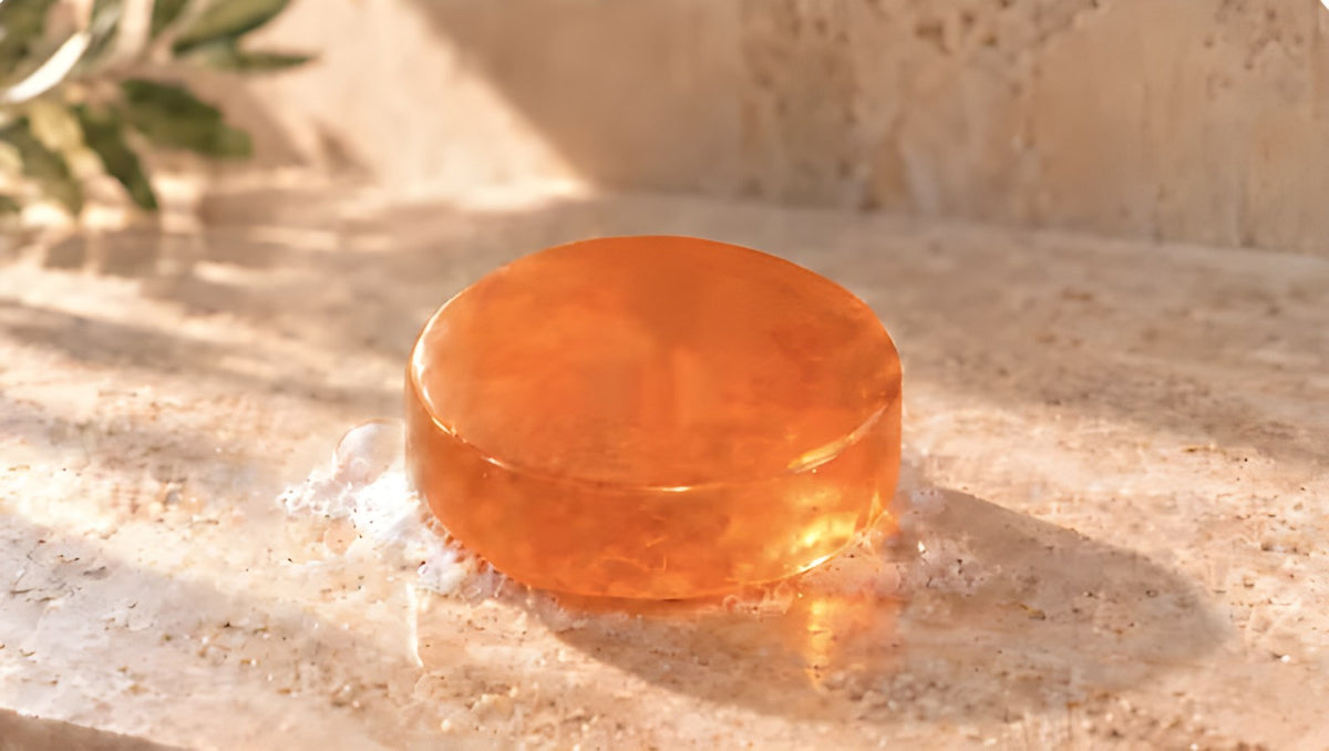 Persimmon soap bar on a sunlit stone ledge